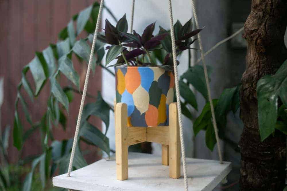 Pot with wooden stand